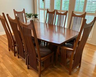 Large solid oak dining table with 8 chairs