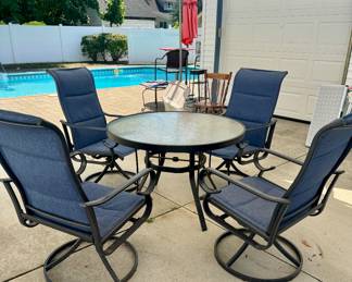 Round Glass Table and Outdoor Chairs