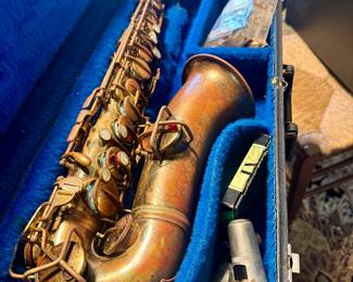 Alto sax in case. Needs some elbow grease