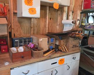 Vintage metal upper and base cabinets, hand tools, and vintage saws