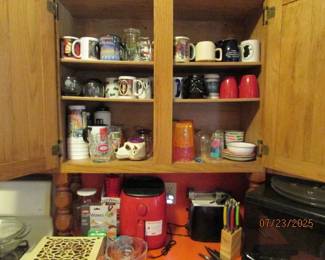assortment of unique mugs, tea box, airfryer, toaster