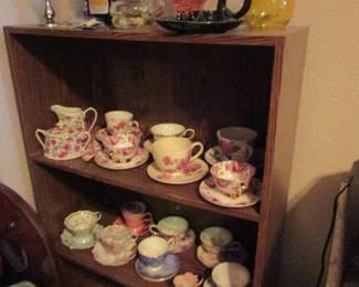 tea cups, oil lamps, bookshelf