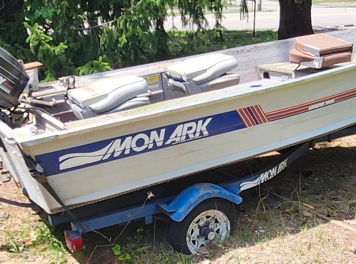 Mon Ark fishing boat comes with trailer and twenty five horsepower mercury available for pre-sale