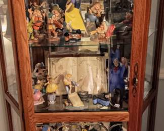 Disney collectors figurines with boxes and certificates, curio cabinet