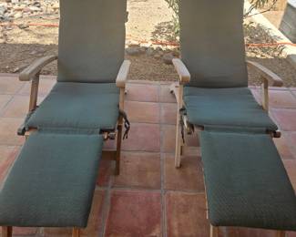 Teak loungers with cushions.