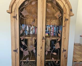 Rustic arched wood cabinet with wrought iron detailing. 46”w x 24”d x 80 t