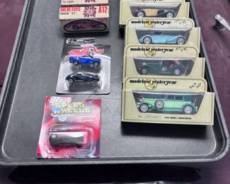 Variety of toy cars in original boxes