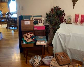 Singer sewing machine, threads, zippers and buttons galore