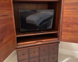 Apothecary-style entertainment cabinet 64"h x 28"w x 27"d