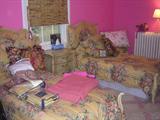 PAIR OF UPHOLSTERED TWIN BEDS, SIDE TABLE, OTTOMAN