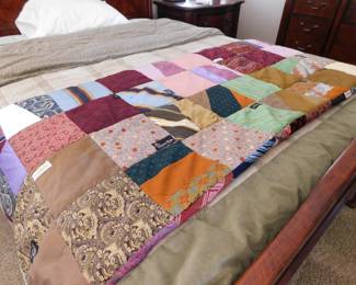 This quilt still has all the original apparel labels from the clothing used in its creation. Johnny Carson, Yves Saint Laurent, Gucci, Versace and many others