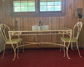 Large wrought iron and glass floral table with two original chairs-