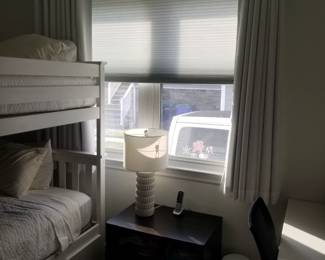 Curtains, rods; blinds by Levolor. Table lamp
