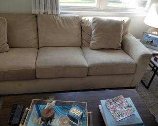 Raymour & Flanigan L-shaped sofa in a neutral tan