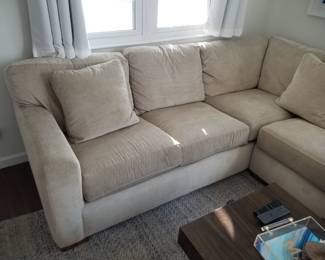 Raymour & Flanigan L-shaped sofa in a neutral tan