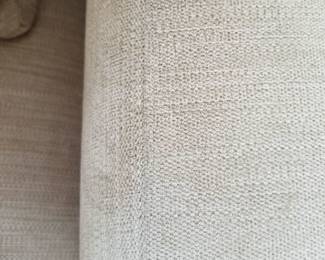 Raymour & Flanigan L-shaped sofa in a neutral tan: fabric detail