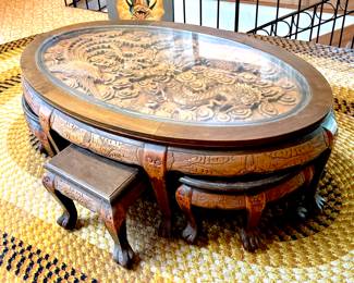Carved Asian low coffee table with "hidden" stools Purchased in Hawaii 70s