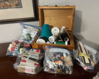 Lots of sewing notions including vintage sewing machine accessories