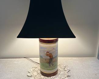 F53- $575. Frank Vosmanski Hand Painted Golfer Lamp. Base is 5.25 d x 20.5" tall.