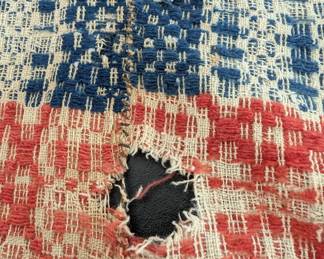 S6 - $30. "Cutter" Coverlet. Measures 64" x 93". Holes are too large to fix - would be better suited for another craft project!
