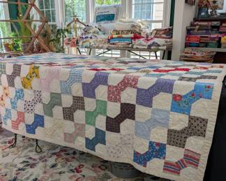 S1 - $50. Vintage Quilt. Measures 58" x 70". Pieced & Hand Quilted.