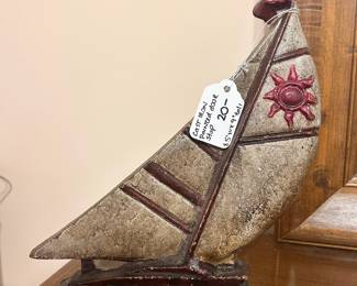 B4 - $20. Cast Iron Painted Doorstop. Measures 8.5" wide x 9" tall