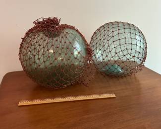 U41 - $100. Pair of Blown Glass Fishing Floats. Measure 9" round.