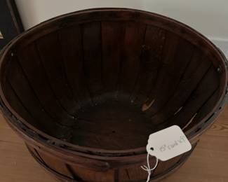 F33- $75. Wooden Apple Swing Basket. Measures 15" round x 9" tall. Carved initials "ER" on the bottom.
