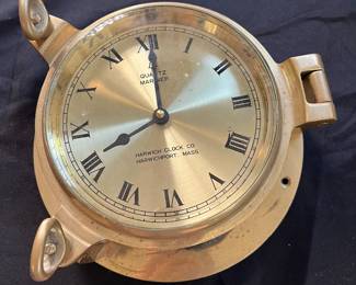 S17 - $50. Harwich Brass Quartz Mariner Ships Clock. Measures 9.25" Diameter