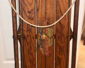 C22 - $150. Flexible Flyer "Racer". Measures 24.5" wide (where the handle is attached) x 6.5" tall x 56" long.