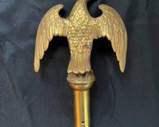 S25 - $50. Antique Brass Eagle Flagpole Topper. Measures 6" wide x 8" tall.