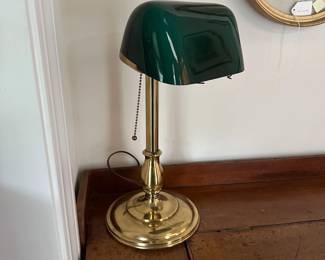 H8 - $175. Emeralite Desk Lamp. #8734 H. Brass base with green glass shade. Measures 17" tall.