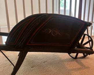 H6 - $125. Primitive Childs Wheelbarrow with removable sides. Metal Wheel. Measures 17.75" wide x 46 .25" deep x 17.25" tall