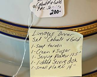 D32- $200. Limoges Dinner Set (9 pieces) Cobalt and Gold - includes 1 soup tureen, 1 cream+ sugar bowl, 1 serving platter (17.5" wide), 1 lidded serving dish, and 1 small platter (14" wide).