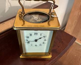 D59 - $175. "CH" Carriage Clock. Measures 3.25" wide x 2.5" deep x 5.5" tall with handle up. Top glass is moving around a bit - not falling out but needs repair.