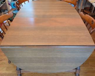 D1 - $150. Tell City Chair Co. Tell City Indiana. Drop Leaf Dining Table and Chairs. Measures 40.75" wide x 29.30 long (without leaves) Each side leaf measures 19.5" long and middle leaf measures 8.5" long. 6 Chairs.