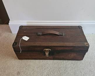 U13 - $75. Antique Wooden Box with Leather Handle. Measures 20" wide x 8.75" deep x 7" tall.