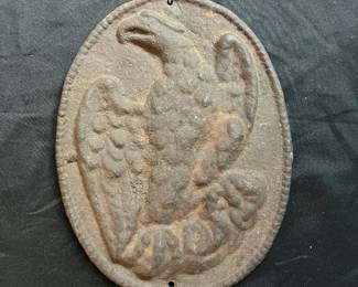 S26 - $60. Antique Cast Iron Eagle INA Plaque. Measures 11" wide x 8.5" tall.