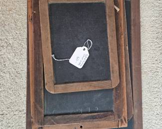 U15 - $50. Set of 5 Early school chalkboard slates. Largest measures 15.75" long x 11" wide, smallest measures 8.5" long x 6.5" wide.