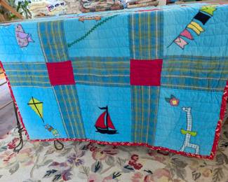 S11 - $60. Hand-pieced and quilted baby blanket. Measures 73" x 42".