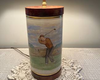 F53- $575. Frank Vosmanski Hand Painted Golfer Lamp. Base is 5.25 d x 20.5" tall.