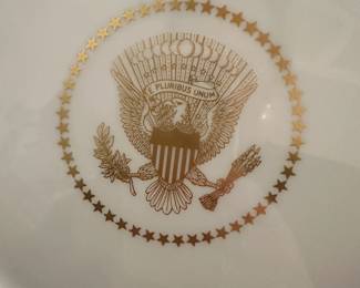 D60 - $1800. Dwight D. Eisenhower White House Plate 1955. Presidential Seal in the center with raised coin gold medallions. Back Stamp reads "Castleton Studios The White House November 1955. Measures 11.5" across. Only 120 produced!