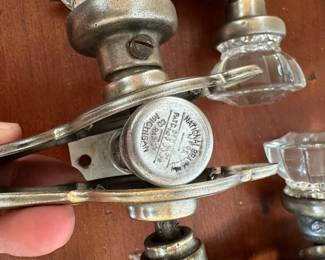 L68 - $200. Set of 12 doorknobs (6 with double handles & 6 single handles with locks). Names read Dexter & National Brass Co.
