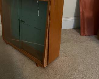 U68 - $60. Wiss Trimline Shears Store Display Case. Right side has veneer peeling that needs glue/repair. Sturdy - 2 glass doors slide. Measures 25.25" wide x 8" deep x 18.5" tall.