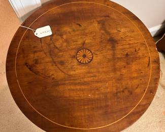 C26 - $50. Inlaid Wooden Table. Measures 16.75" across x 27" tall. Top has what looks like heat rings but it is sturdy!