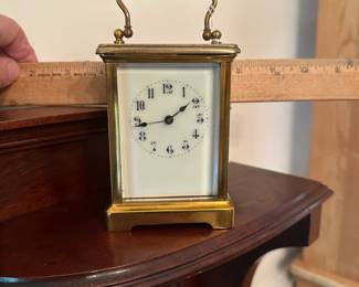 D59 - $175. "CH" Carriage Clock. Measures 3.25" wide x 2.5" deep x 5.5" tall with handle up. Top glass is moving around a bit - not falling out but needs repair.