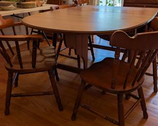 D1 - $150. Tell City Chair Co. Tell City Indiana. Drop Leaf Dining Table and Chairs. Measures 40.75" wide x 29.30 long (without leaves) Each side leaf measures 19.5" long and middle leaf measures 8.5" long. 6 Chairs.