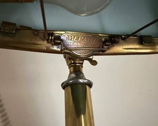 H8 - $175. Emeralite Desk Lamp. #8734 H. Brass base with green glass shade. Measures 17" tall.