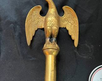 S25 - $50. Antique Brass Eagle Flagpole Topper. Measures 6" wide x 8" tall.