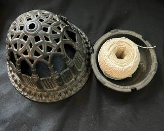 S24 - $35. Antique Cast Iron String Holder. Measures 6" wide x 5" tall.